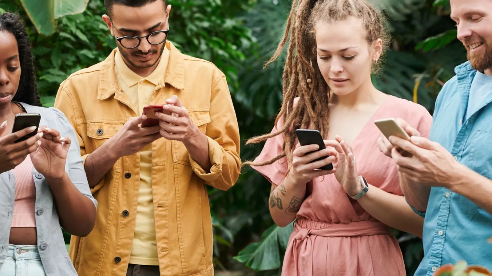 A group of friends looking at their phones