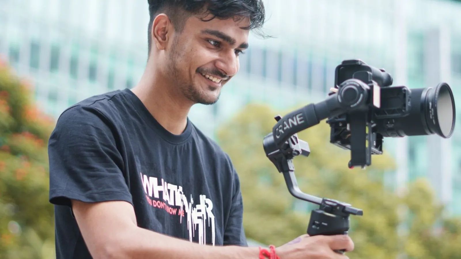 A creator filming with a camera on a gimbal